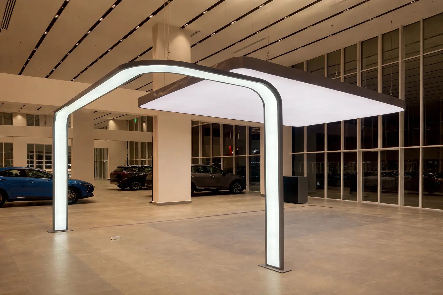 Translucent backlit stretch ceiling installation in automotive showroom